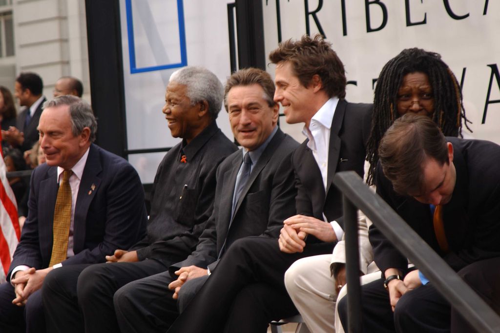 View of, from left, New York City Mayor Michael Bloomberg, South African activist and politician Nelson Mandela, and actors Robert De Niro, Hugh Grant, and Whoopi Goldberg during the 2002 Tribeca Film Festival's Opening Night Ceremony at City Hall, New York, New York, May 8, 2002