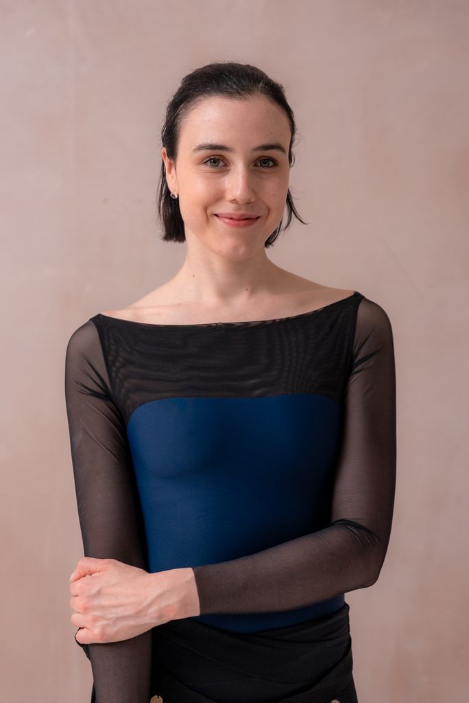 Woman in black and navy ballet outfit