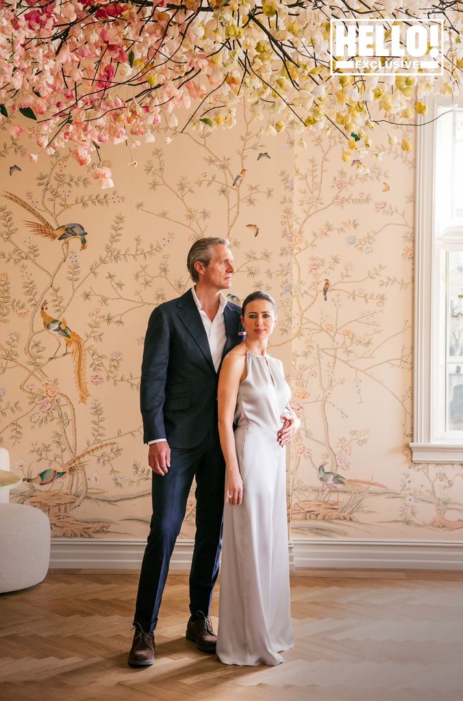 Camilla Austad Knutsen and husband John Eric Knutsen posing in Oslo home's floral room