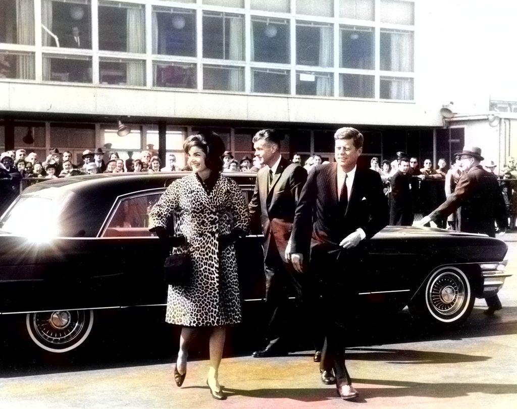 US President John F Kennedy and Jacqueline Kennedy exit an automobile, 1961. Courtesy Abbie Row/National Parks Service. Note: Image has been digitally colorized using a modern process. Colors may not be period-accurate. (Photo via Smith Collection/Gado/Getty Images).