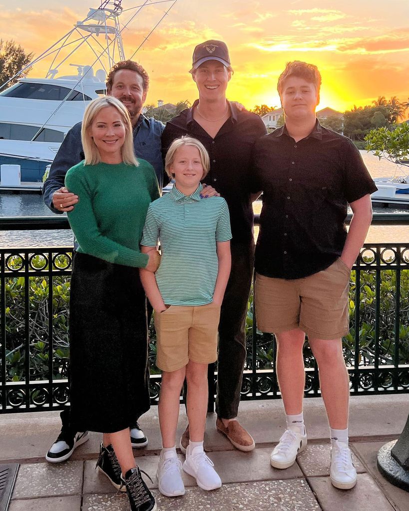 The Hauser's pose for a family photo at sunset 