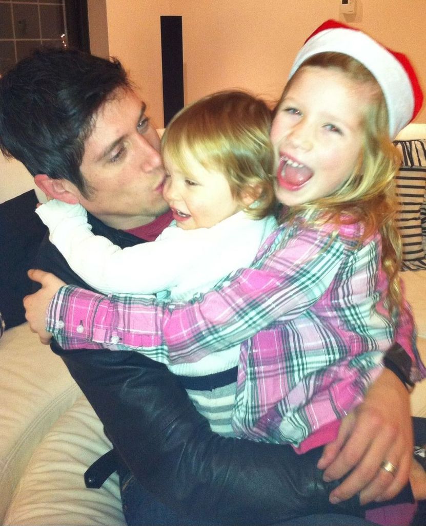 Vernon Kay hugging daughters as children