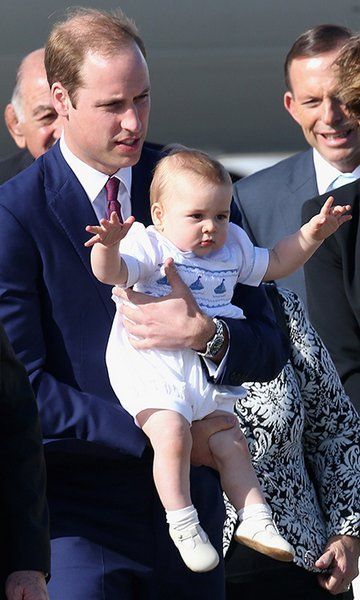 prince william holding tight onto prince george