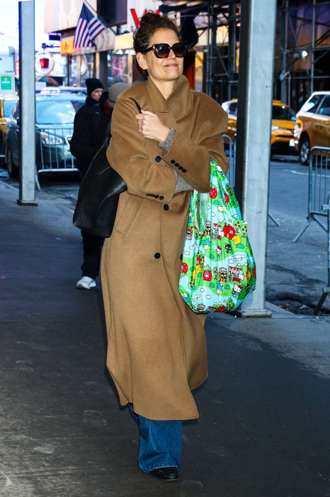 Katie Holmes is seen in New York City in brown coat