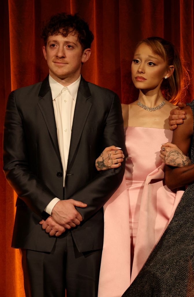 Ethan Slater and Ariana Grande accept the Best Film Award for "Wicked" 