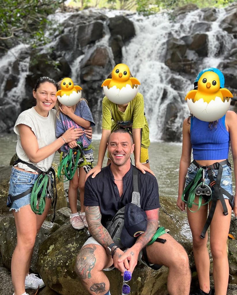 Emma and Matt Willis with their kids in front of a waterfall