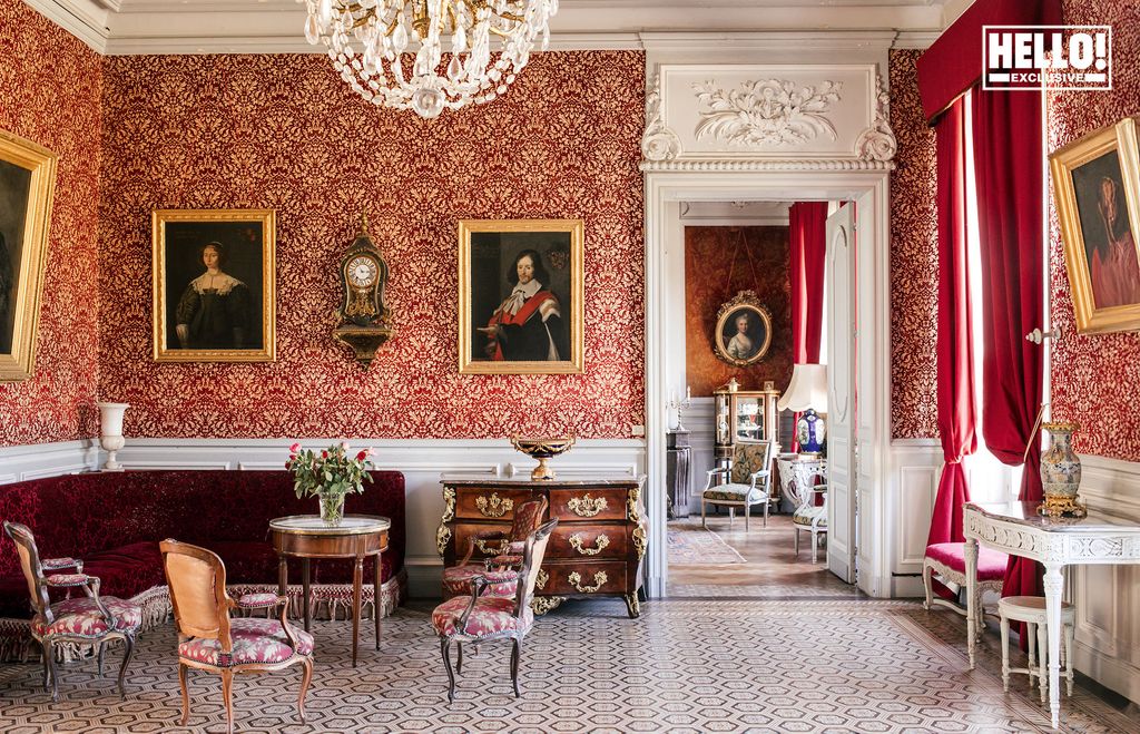 Baron Arnaud De Bastard's red drawing room at Chateau de Saint-Denis