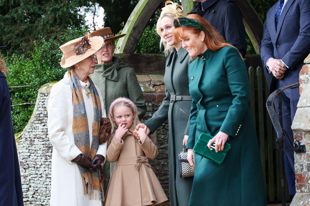 Lena leaning against Princess Anne as she chats to Zara Tindall and Sarah Ferguson
