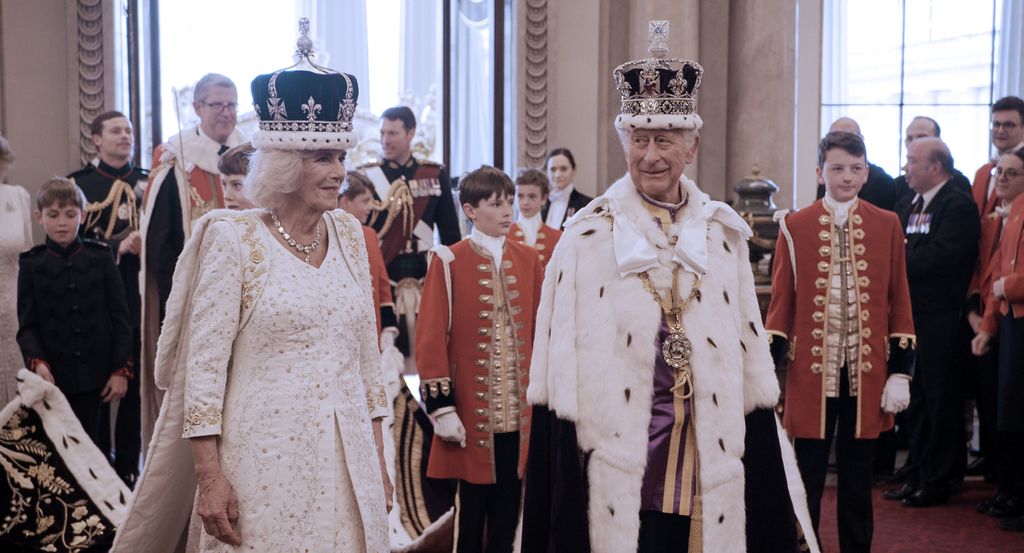 King Charles and Queen Camilla in their robes and crowns after their coronation