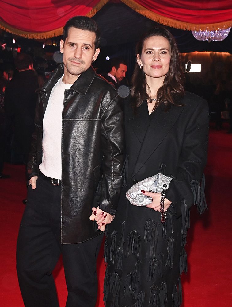 Hayley Atwell and Ned Wolfgang Kelly holding hands at the Cirque du Soleil premiere in London