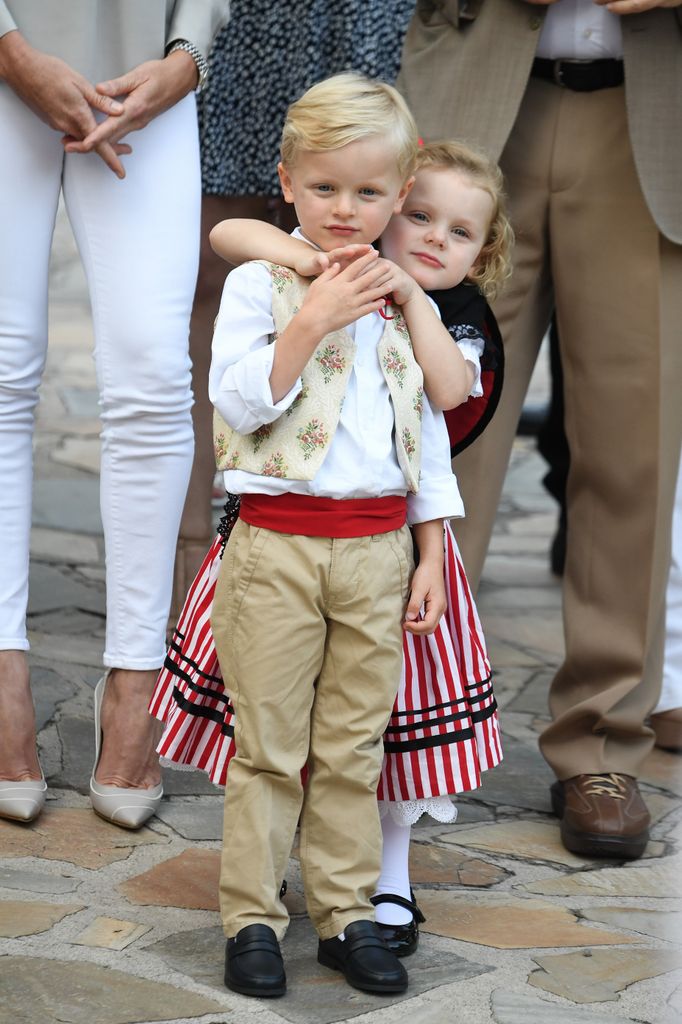siblings sharing hug at picnic event
