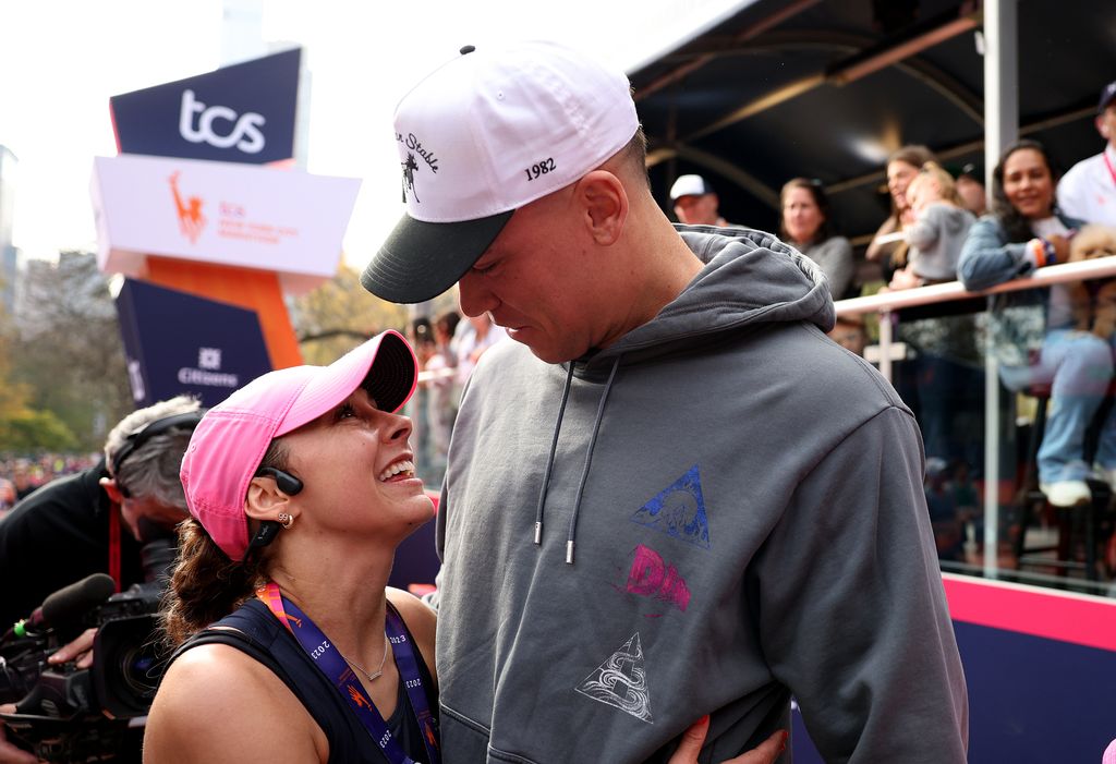 Aaron Judge congratulates his wife Samantha Bracksieck Judge after she crossed the finish line during the 2023 TCS New York City Marathon on November 05, 2023 in Central Park in New York City