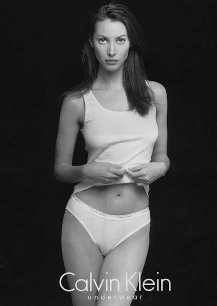 Christy Turlington poses in a pair of white briefs and a singlet for Calvin Klein in 1995