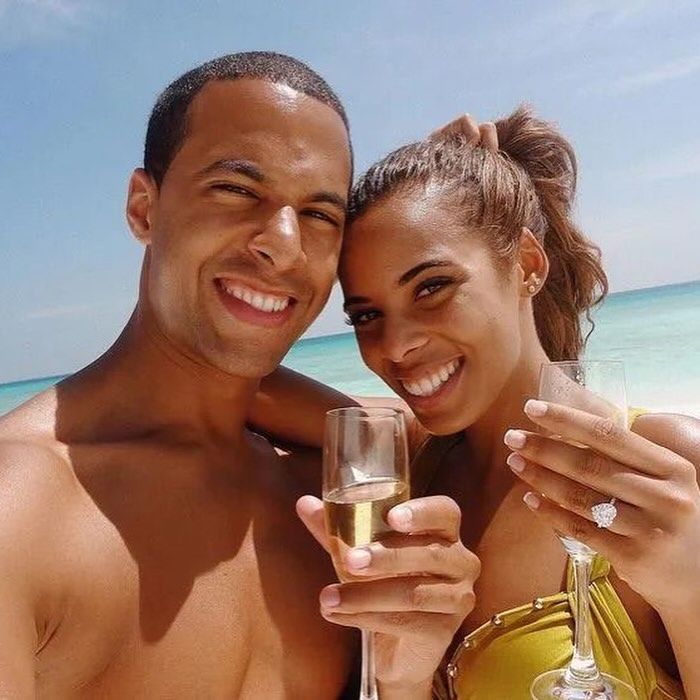 Marvin and Rochelle Humes posing on a beach with champagne