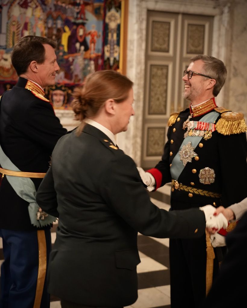 King Frederik greeting his brother Prince Joachim at the reception