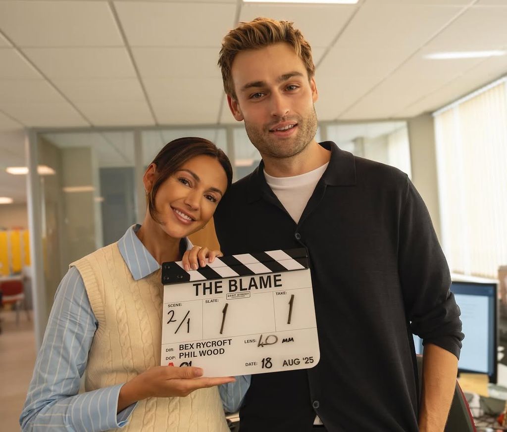 two actors holding clapperboard