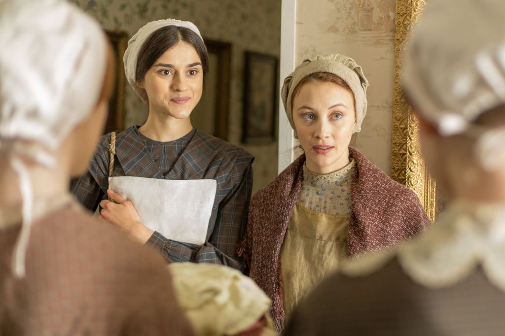 Sarah Gadon as Grace Marks and Rebecca Liddiard as Mary Whitney in Alias Grace