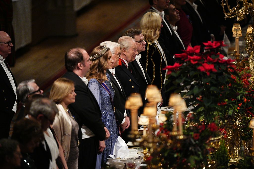 King Charles III, Germany's President Frank-Walter Steinmeier and Catherine, Princess of Wales during the state banquet at the dining table 