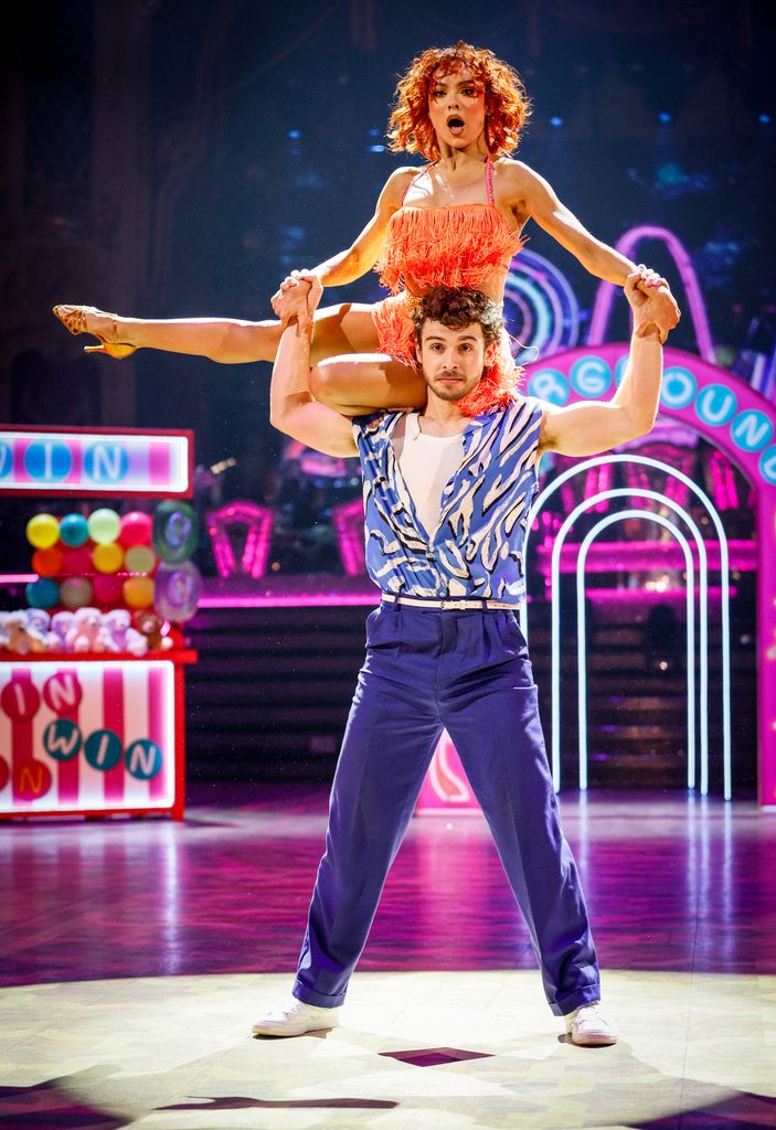 George Clarke and Alexis Warr dancing a salsa