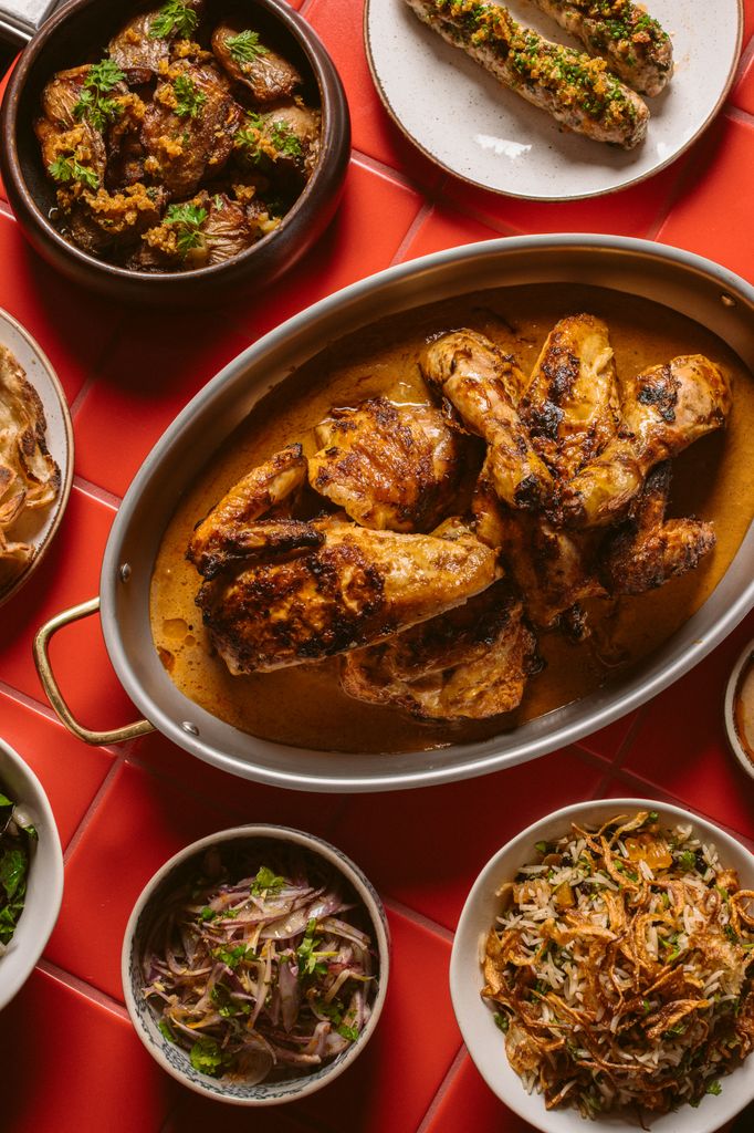 Sunday roast chicken and side dishes flat lay