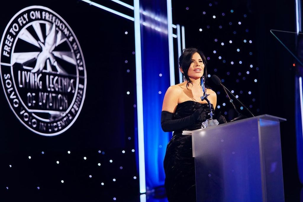 Lauren Sanchez stands on stage as she accepts her honor