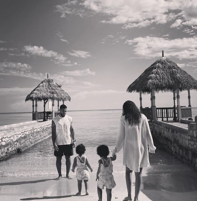 Leigh Anne Pinnock and Andre Gray with their children in front of the sea