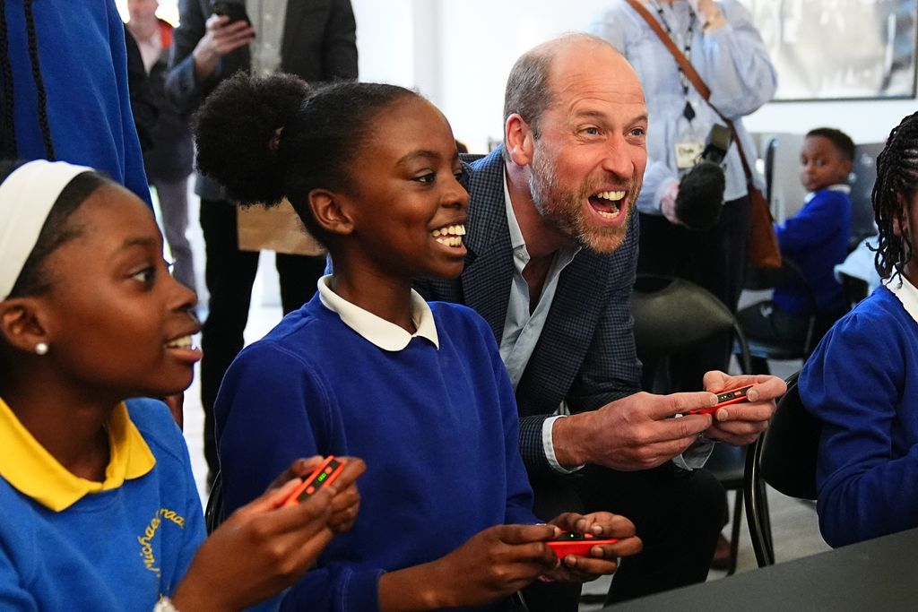 William plays a computer game during a visit to the Mentivity community centre and youth hub in Southwark