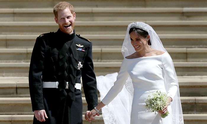 prince harry and meghan holding hands wedding
