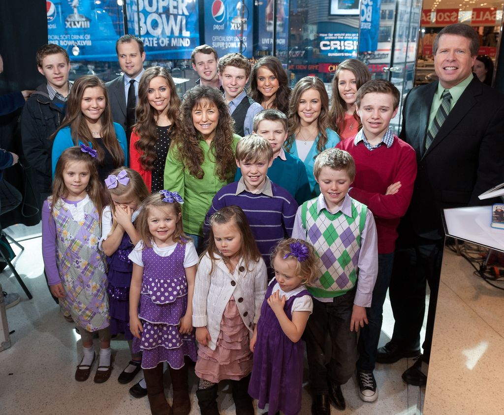 The Duggar family visits "Extra" at their New York studios at H&M in Times Square on March 11, 2014 in New York City
