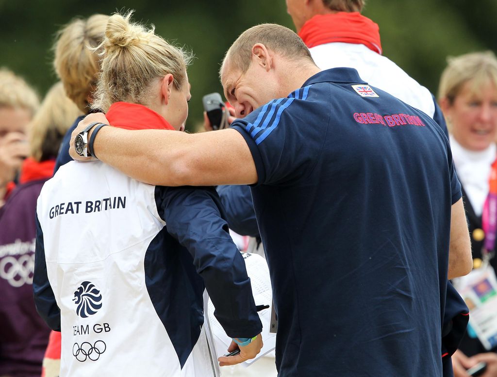 Mike Tindall puts arm around wife Zara after she wins silver medal