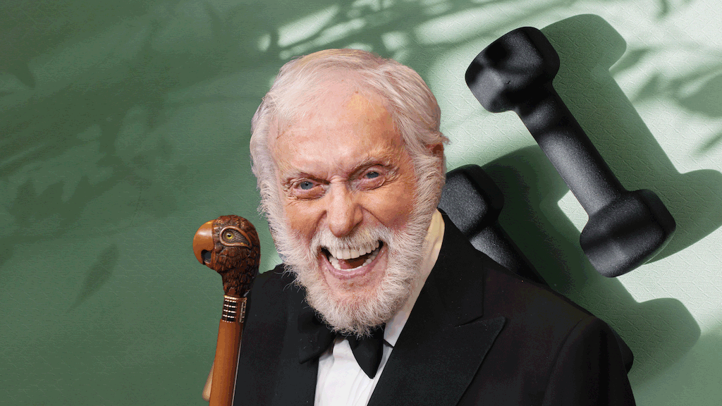 Dick Van Dyke in suit with yoga mat and dumbbells backdrop
