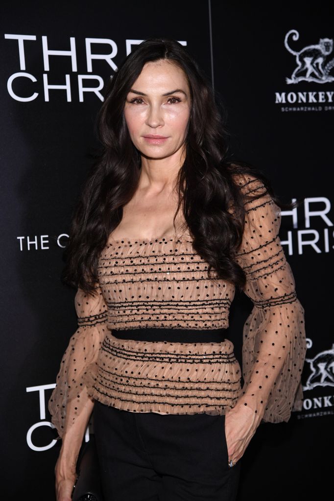 Famke Janssen wearing a biege and brown detailed puffed sleeved top 