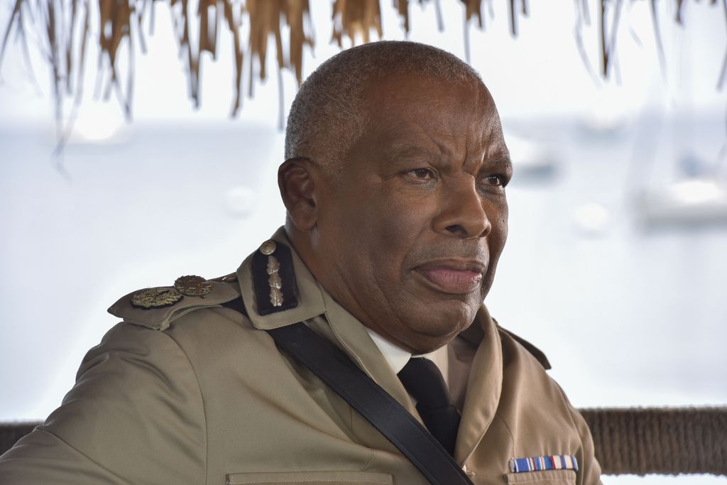 Man in khaki coloured uniform