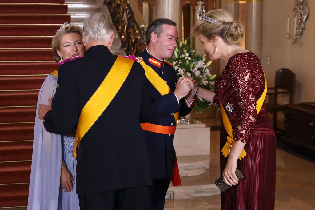 The couple were seen greeting Queen Mathilde and King Philippe of Belgium