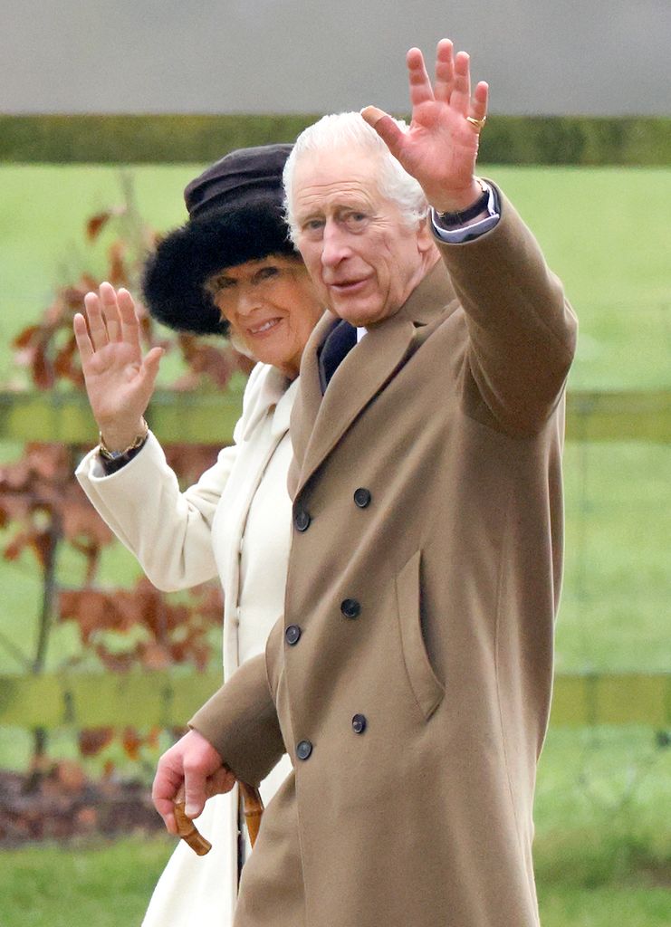 King Charles III and Queen Camilla waving outside church 
