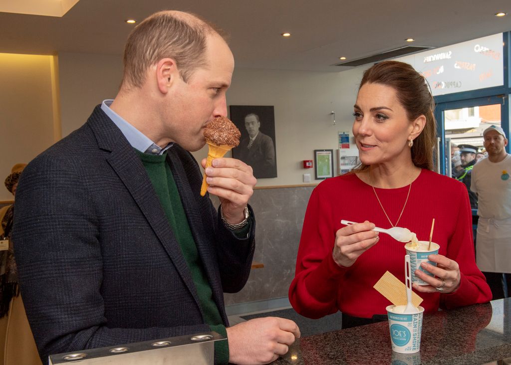 Prince William, Duke of Cambridge and Catherine, Duchess of Cambridge eat ice cream during a visit to Joe's Ice Cream Parlour in the Mumbles