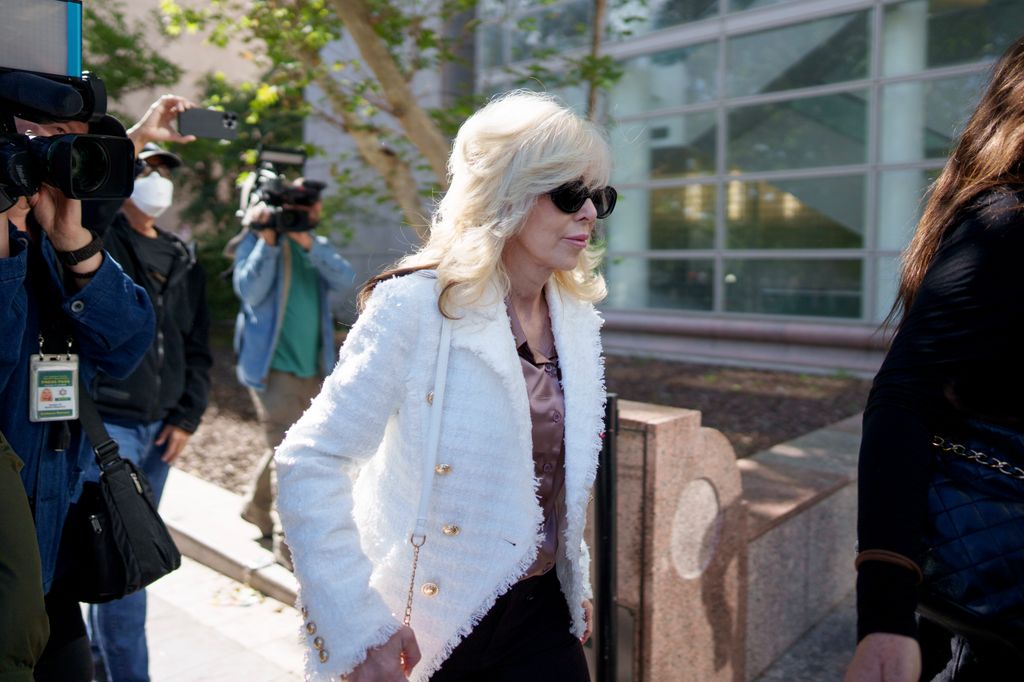 photo of tammi menendez in white blazer outside courthouse