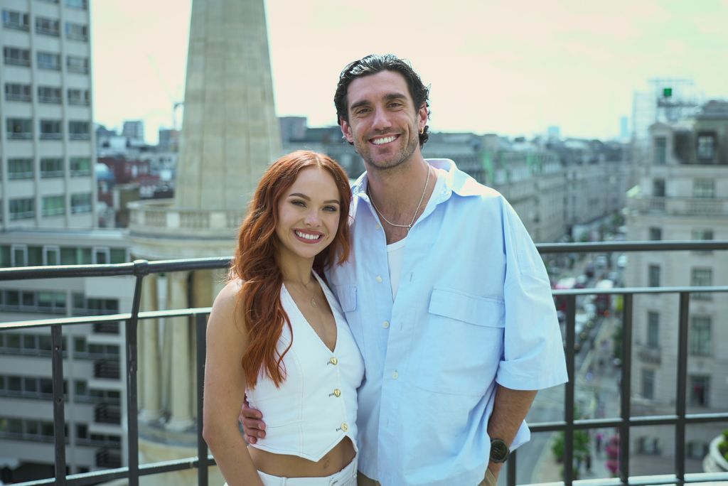 Alexis and Julian on rooftop smiling