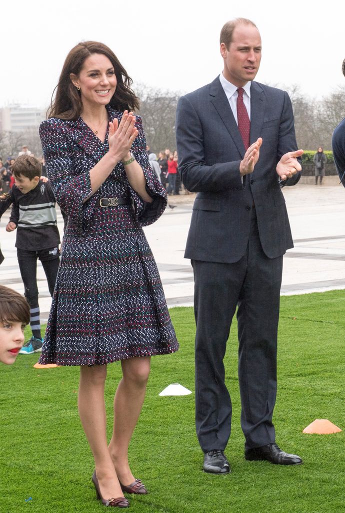 Catherine and Prince William clapping outside