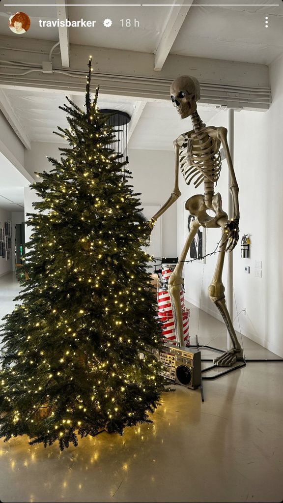 Christmas tree with a huge skeleton next to it