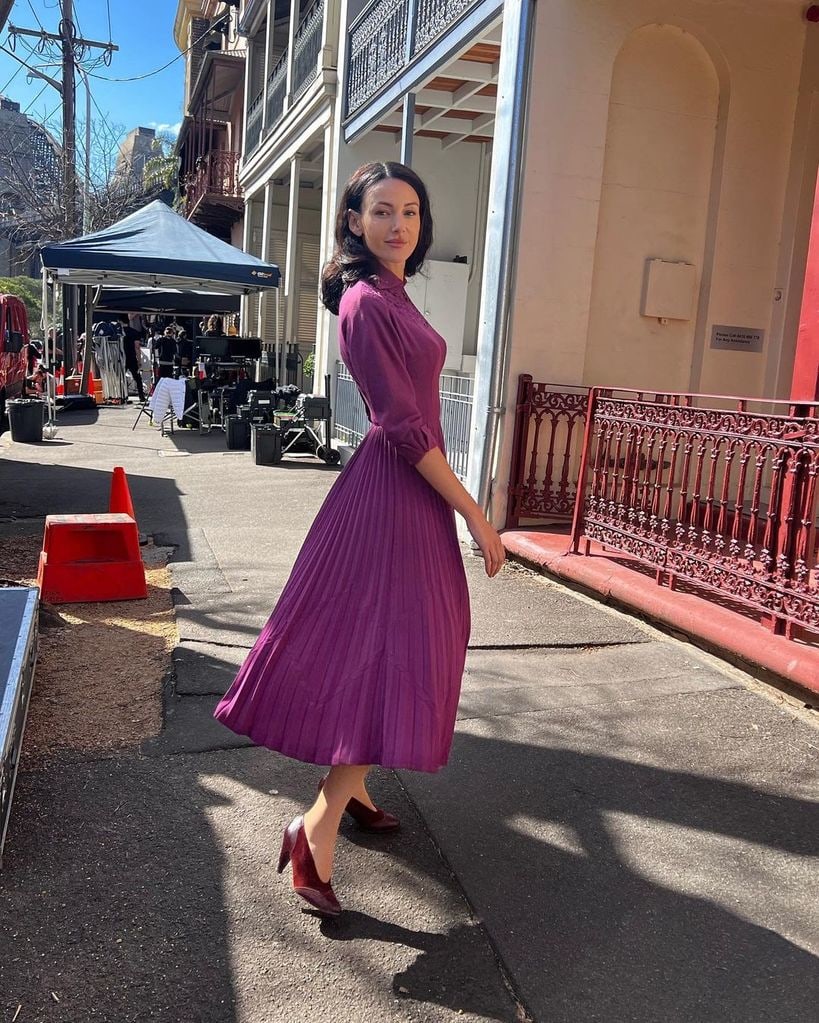 Michelle rocking her purple dress