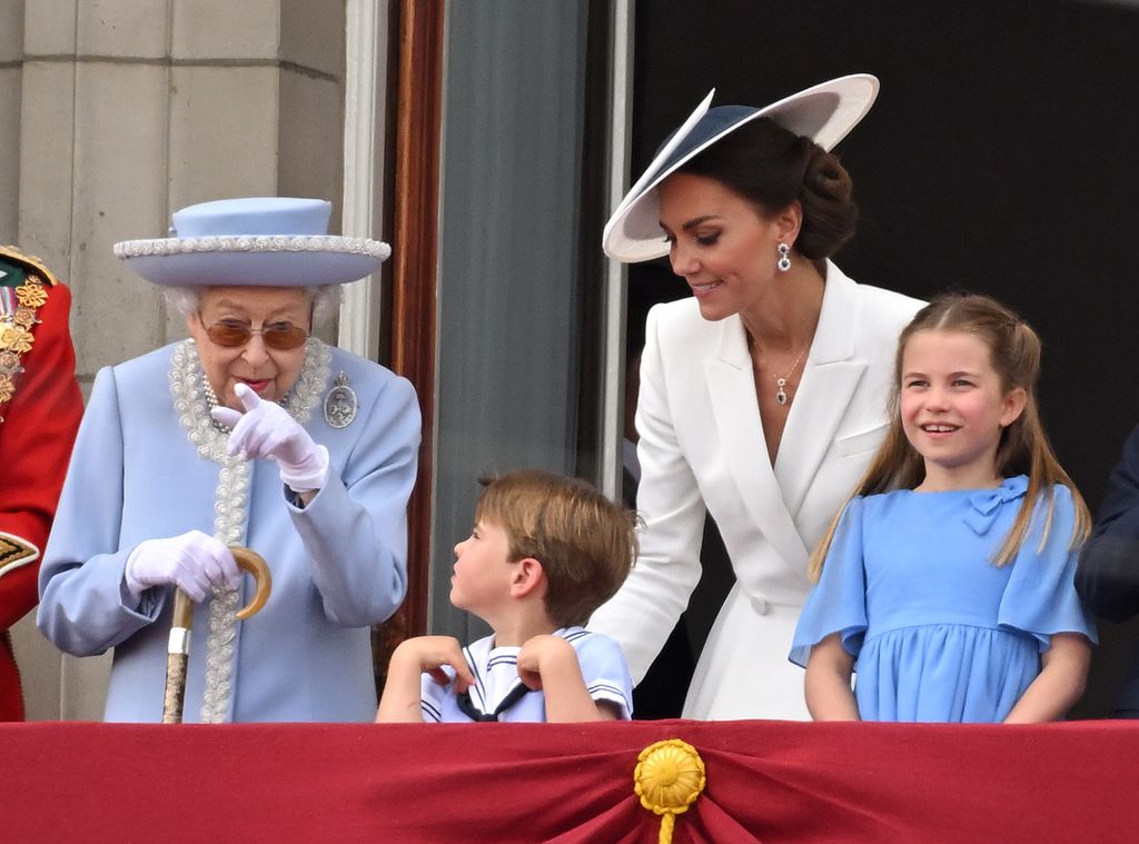 Queen Elizabeth II, Prince Louis, Princess Kate and Princess Charlotte during Trooping the Colour in June 2022