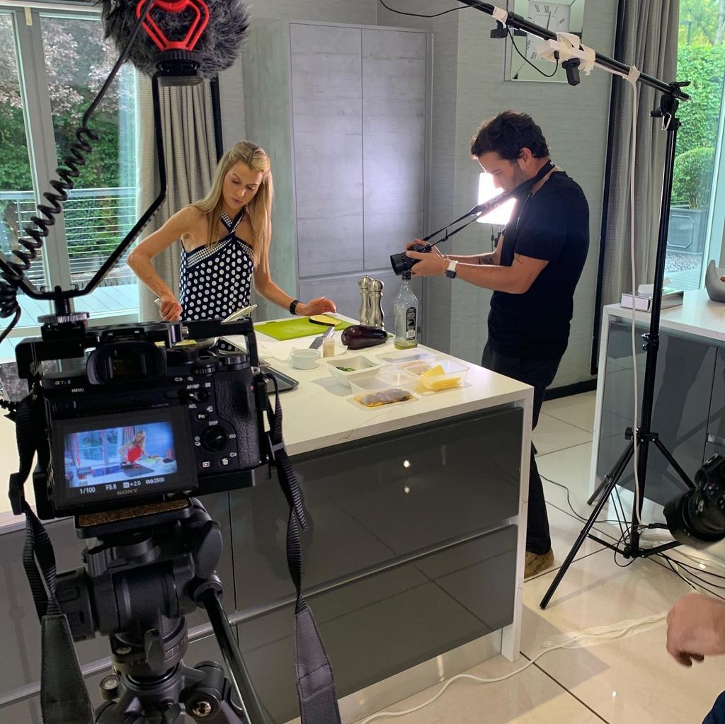 Julie Neville cooking in her grey kitchen
