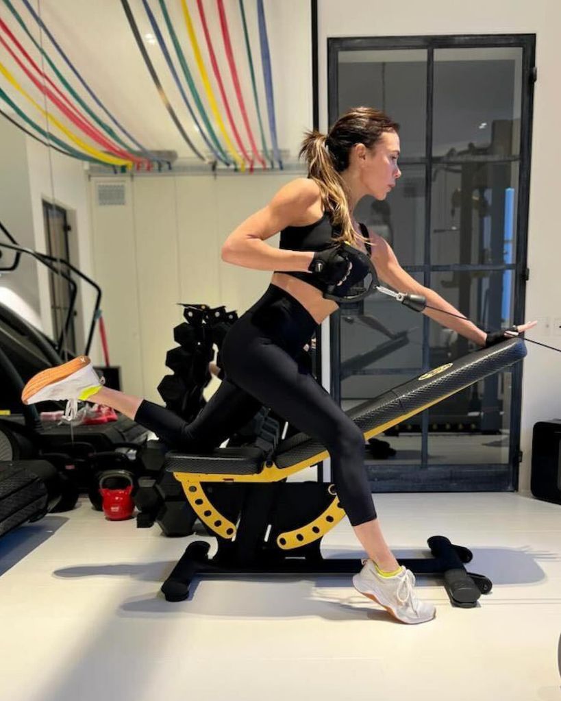 A photo of Victoria Beckham performing an arm exercise 