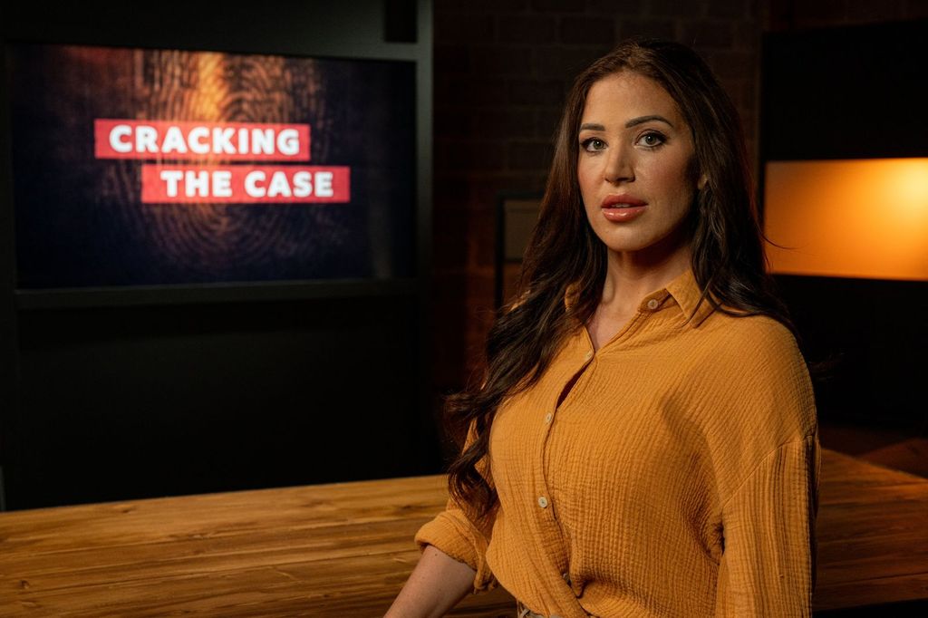 A woman wears an orange shirt