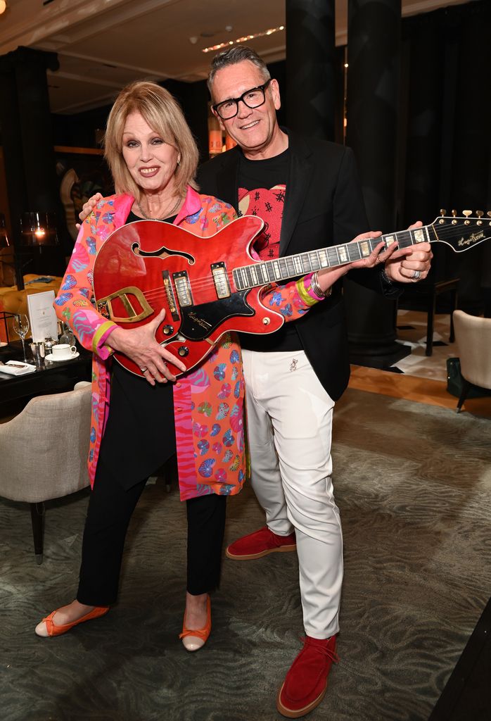 Joanna Lumley and Mark Aldridge , Patron The Prince's Foundation , play with guitar