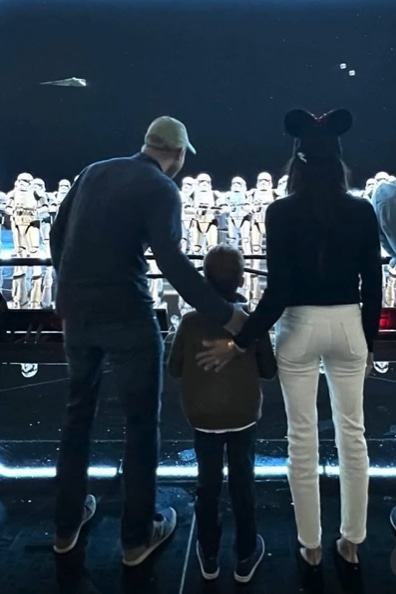 Harry, Archie and Meghan looking at Stormtroopers at Disneyland