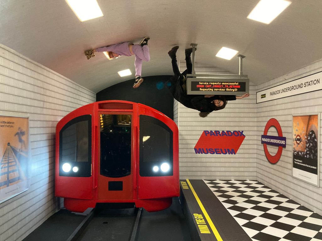 London Tube exhibit with upside down people