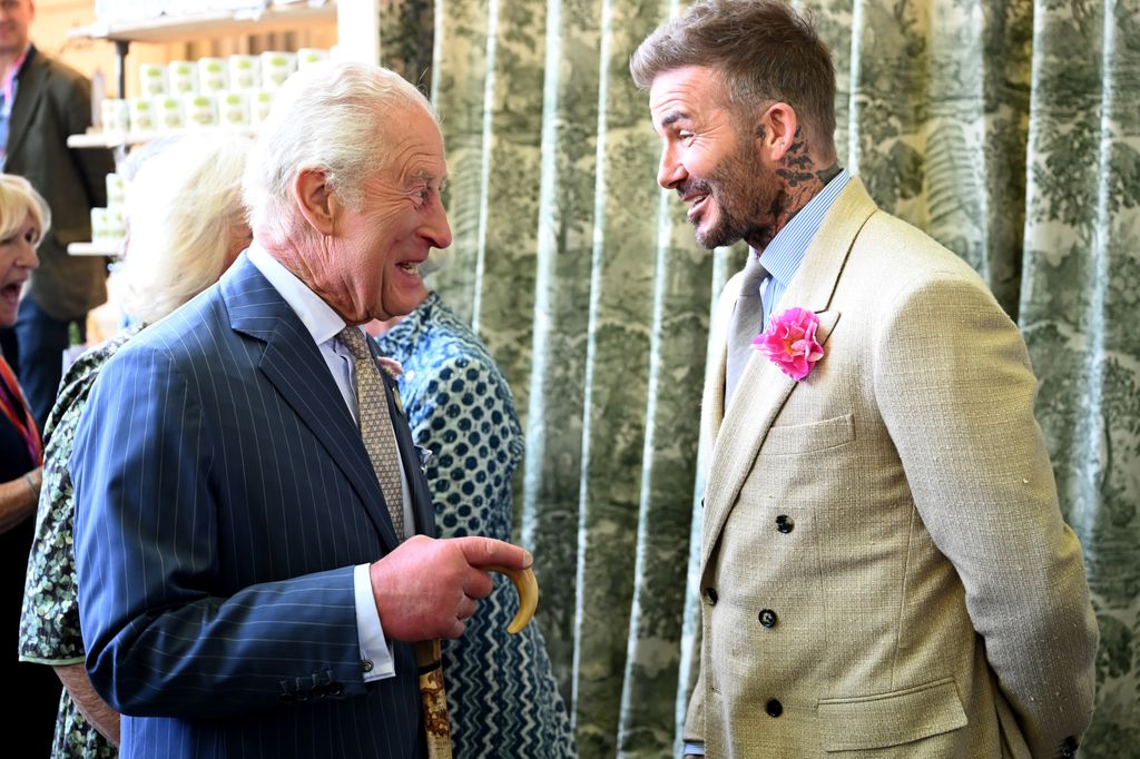 david beckham and king charles laughing 