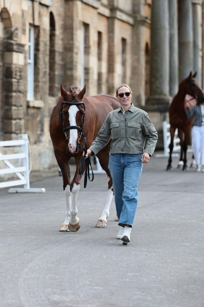 Zara Tindall wearing jeans during horse inspection at Bramham Horse Trials